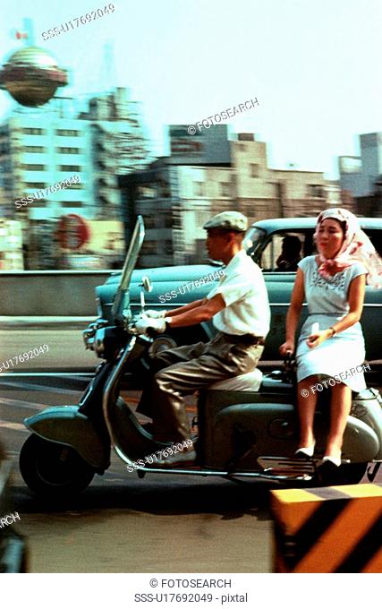 Man and woman on Scooter