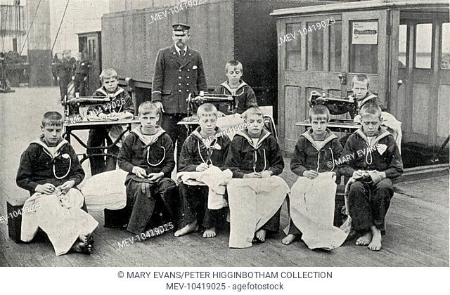 Boys taking part in a tailoring class on the Training Ship Wellesley, on the River Tyne at North Shields, Northumberland