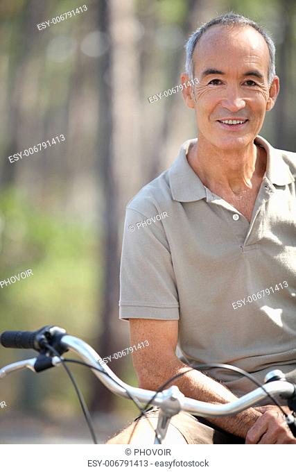 Middle-aged man riding bike