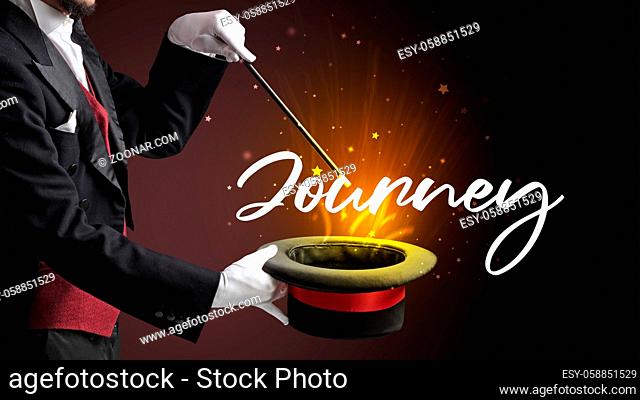 Magician is showing magic trick with Journey inscription, traveling concept