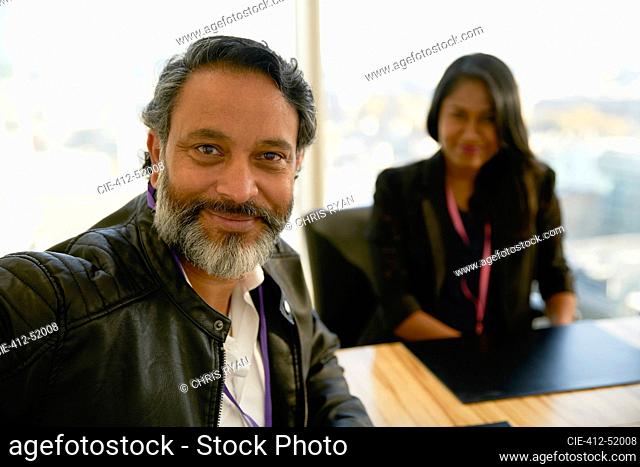 Portrait confident businessman in conference room