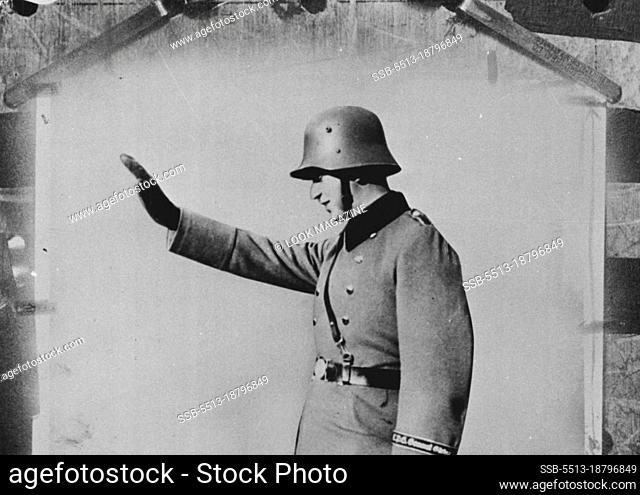 The soldier gives a salute made famous by Adolf Hitler. January 01, 1951. (Photo by Look Magazine)