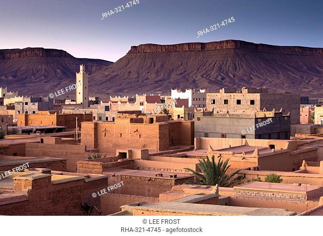 View over town of Nkob bathed in morning sunlight with modern minaret in the distance, Nkon, southern Morocco, Morocco, North Africa, Africa