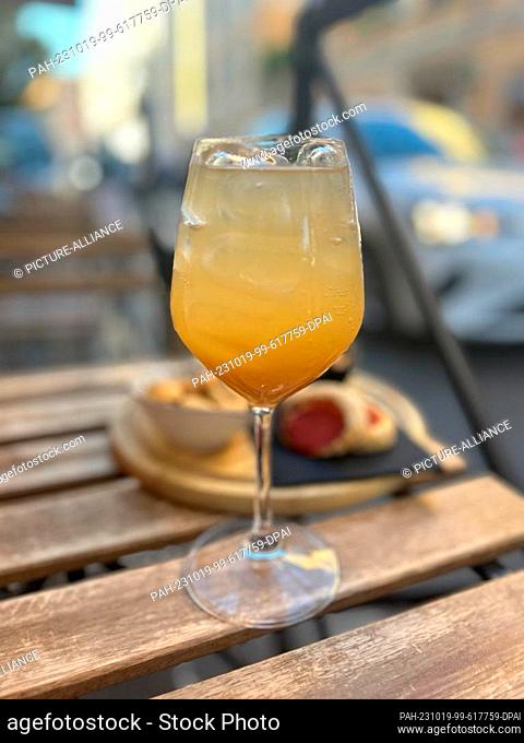 11 October 2023, Italy, Rom: The ""Bellini"" stands on a table in the outdoor area of a bar. The ""Bellini"" is such a classic that you can even get it in...