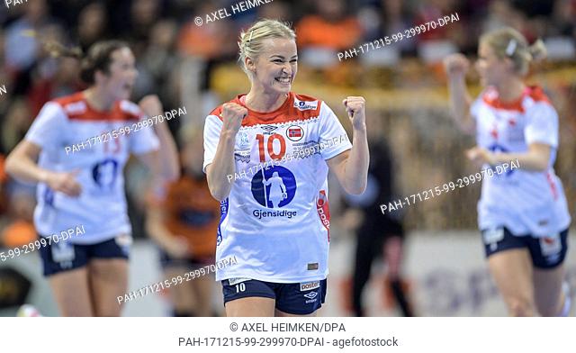 Norway's Stine Bredal Oftedal (C) celebrating a score during the 2017 World Women's Handball Championship semi-final match between Norway and the Netherlands in...