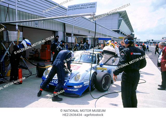 1999 Porsche 911 GT2 in pits.FIA GT Silverstone 500. Artist: Unknown