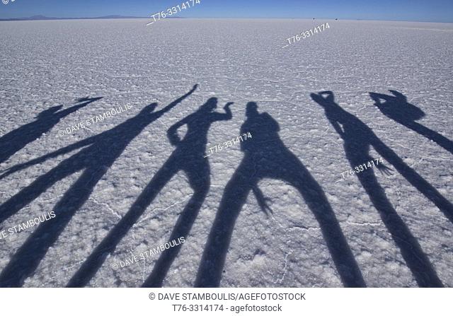 World's longest shadows on the vast salt flats of Salar de Uyuni, Bolivia