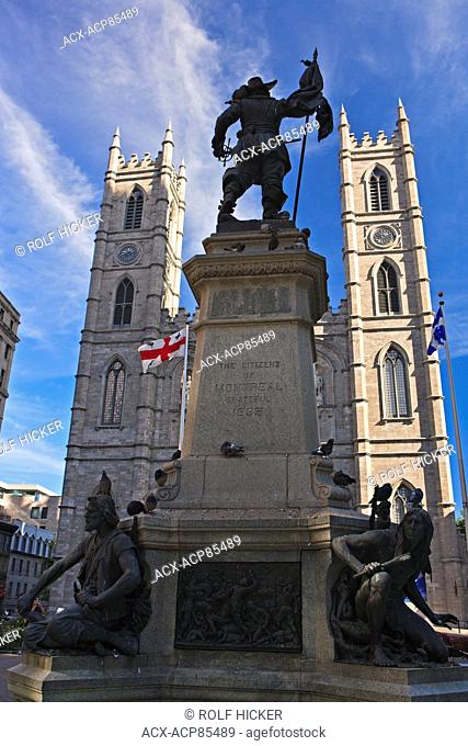 Statue of Paul de Chomedey de Maisonneuve, a military officer, in Place d'Armes, backdropped by Notre-Dame Basilica, Old Montreal, Montreal, Quebec, Canada