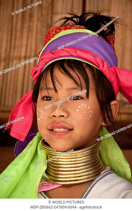 Young girl of the Karen hill tribe wearing traditional neck coil at Baan Tong Luang, a village of Hmong people in Chiang Mai Province, Thailand
