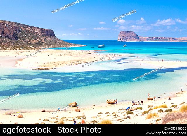 Breathtaking panorama of Balos beach and lagoon and Gramvousa island on Crete, Greece. Tourist boats mooring in lagoon