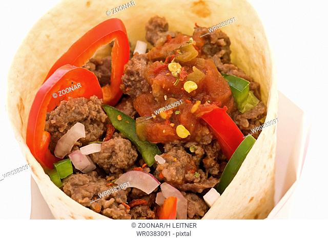 Tacos with hash and vegetables as closeup on white background