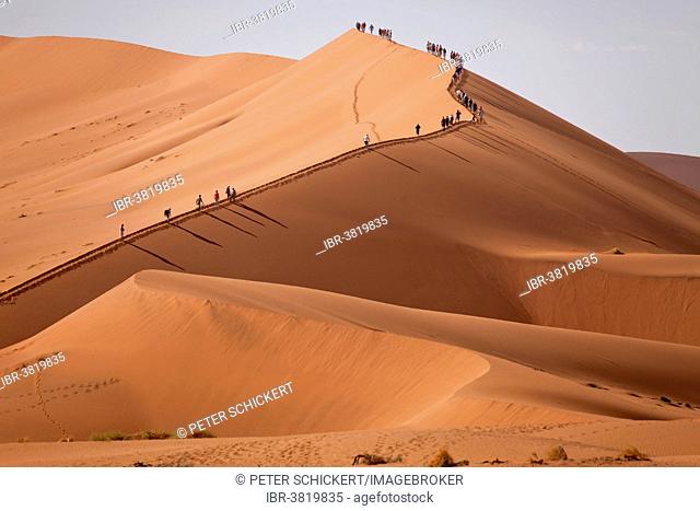 Tourists climbing the Sossusvlei Dunes, Namib-Naukluft National Park, Namibia