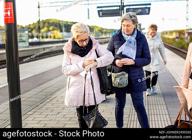 Senior women at train platform