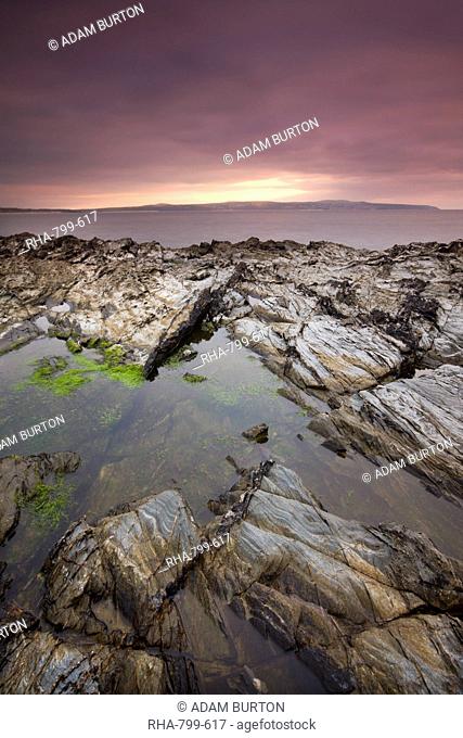 Rockpool on the rocky shores of Godrevy Point looking across to St. Ives, Cornwall, England, United Kingdom, Europe