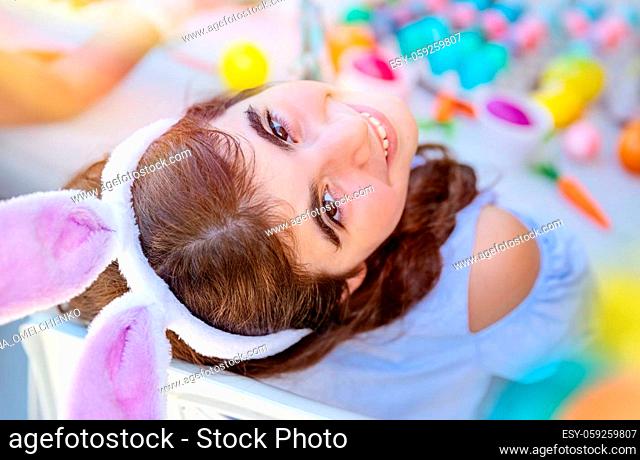 Portrait of a Cute Little Girl Wears a Bunny Ears. Kid Enjoying Happy Easter Holiday. Coloring Egg Decorations
