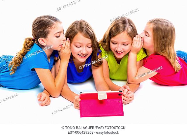 sisters cousins kid girls with tech tablet pc playing happy lying on white background