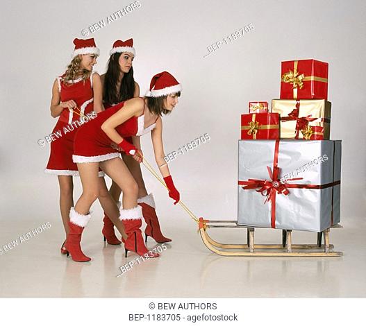 Three girls in christmas disguise