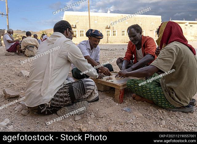 men play domino game (CTK Photo/Ondrej Zaruba)