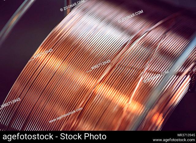 Working atmosphere in an old welding shop with a focus on the coil of welding wire for automatic welding in shielding gases