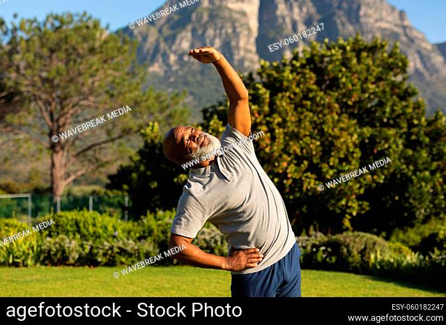 Senior african american man exercising outdoors in stunning countryside