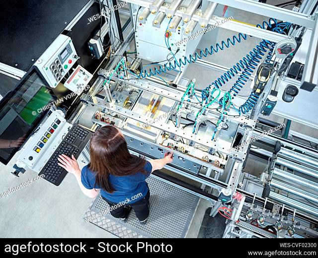 Young technician working at factory
