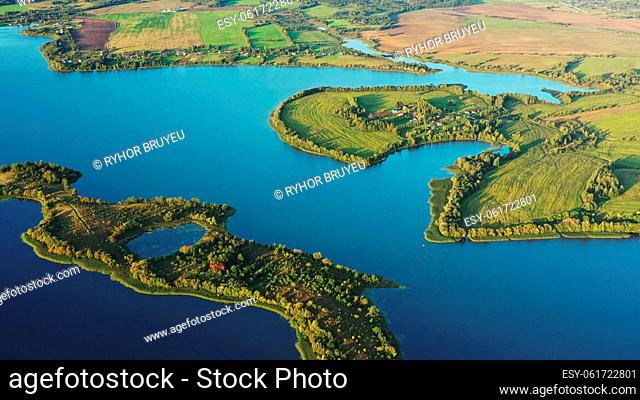 4K Blue Water Of Lake River And Green Countryside Landscape With Growing Greenery Forest. Aerial View Of Rivers Coast Islands