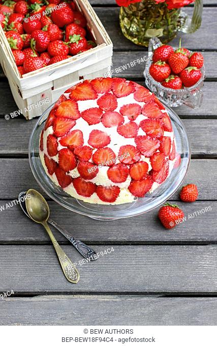 Strawberry cake on cake stand. Party dessert