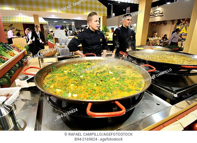 Cooks making a paella in Alimentaria, International Food and Drinks Exhibition, Fira de Barcelona. L'Hospitalet de Llobregat, Barcelona, Catalonia, Spain