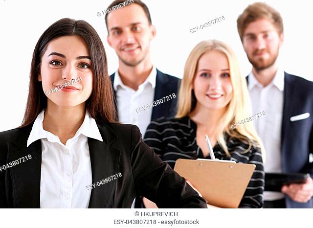 Group of smiling people stand in office looking in camera portrait. White collar power mediation solution project creative advisor participation profession...