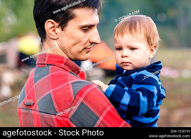 Portrait of happy father and son outdoors
