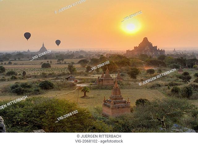 ASIA, MYANMAR, BURMA, BIRMA, BAGAN, PAGAN, sunrise over Bagan, hot air balloons, many Pagodas in front - BAGAN, PAGAN, MYANMAR, 04/09/2009