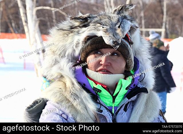 RUSSIA, KAMCHATKA REGION - FEBRUARY 26, 2023: A woman enjoys festivities marking Reindeer Breeder Day in the village of Esso, Bystrinsky District