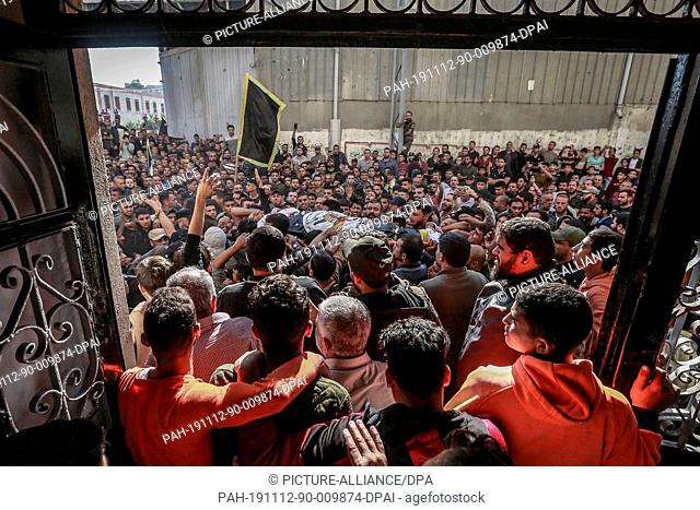 12 November 2019, Palestinian Territories, Gaza: People attend the funeral of the Palestinian Islamic Jihad leader Baha Abu Al-Atta after an Israeli air strike...