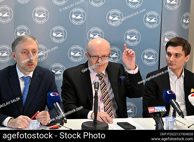 L-R Director of an organisation operating a vaccination centre Jindrich Voboril, Czech Health Minister Vlastimil Valek and Ukrainian doctor working in Prague...