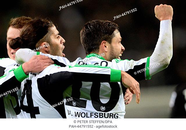 Wolfsburg's Ricardo Rodriguez (L) celebrates his 1-0 goal with teammate Diego during the Bundesliga soccer match between VfL Wolfsburg and VfB Stuttgart at...