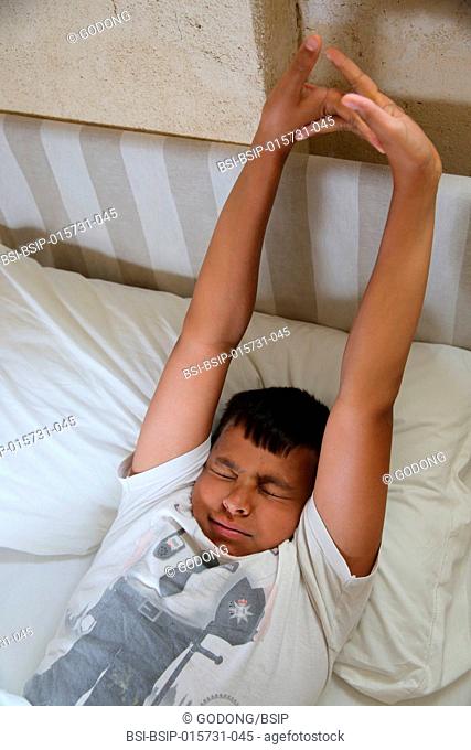 11-year-old boy waking up in Salento, Italy