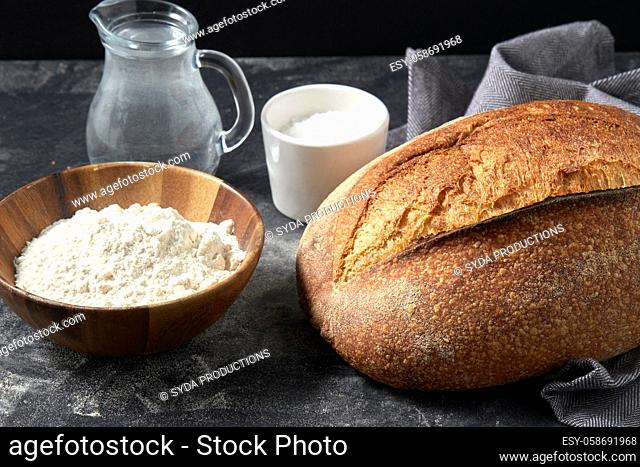 bread, wheat flour, salt and water in glass jug