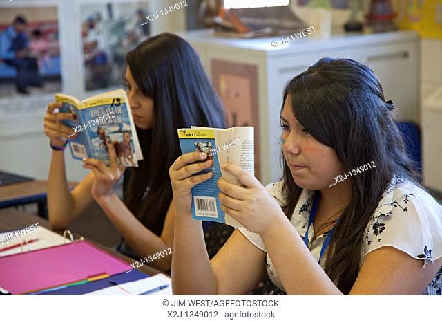 Española, New Mexico - Eighth grade students read 'The Call of the Wild' in language arts class at McCurdy School, a private school supported by the United...
