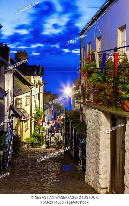 Steep narrow cobbled street leading down to the world famous fishing village of Clovelly, Devon, England, United Kingdom, Europe