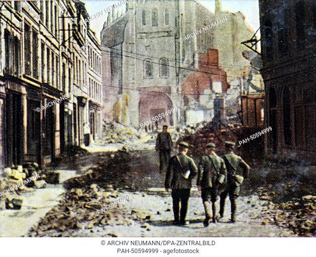 The contemporary colorized German propaganda photo shows German soldiers in front of the destroyed St. Quentin Basilica along the Siegfried Front (from Arras...