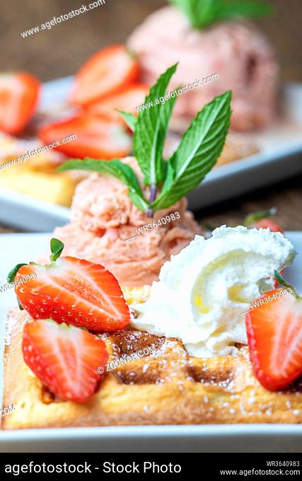 belgian waffle with strawberries on white