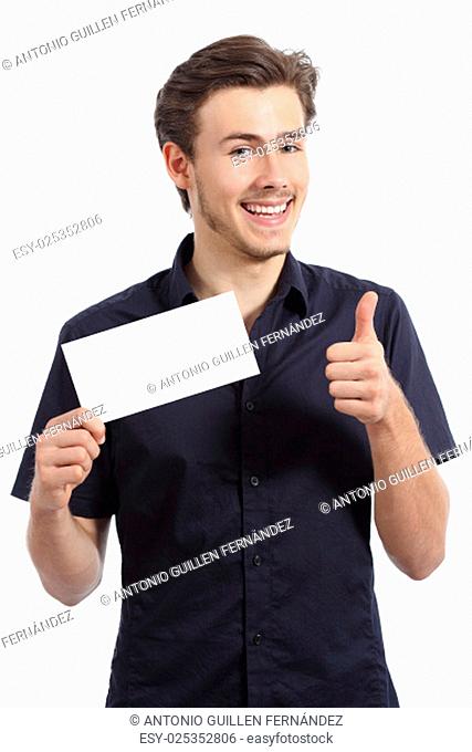 Happy man showing a blank card gesturing thumbs up isolated on a white background