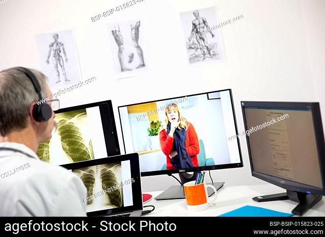 A GP during a video consultation looking at the x-ray of a woman’s lungs who has a lung infection