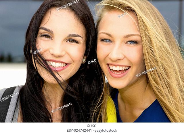 Portrait of a beautiful two young girls smiling