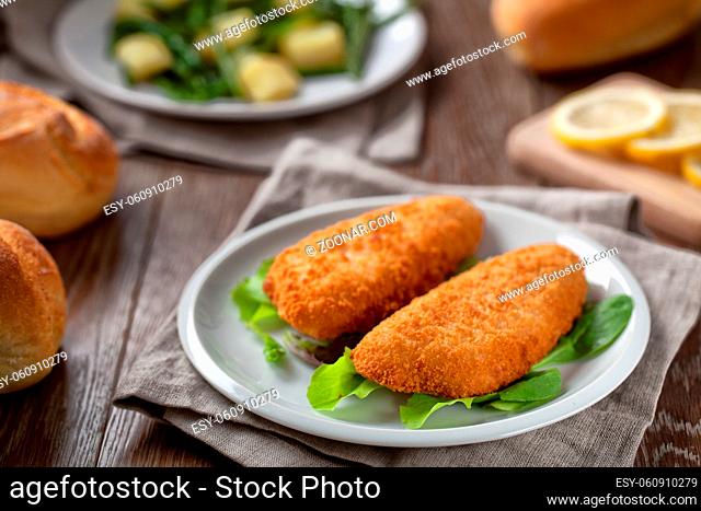 Breaded Fish Fillet With Salad. High quality photo