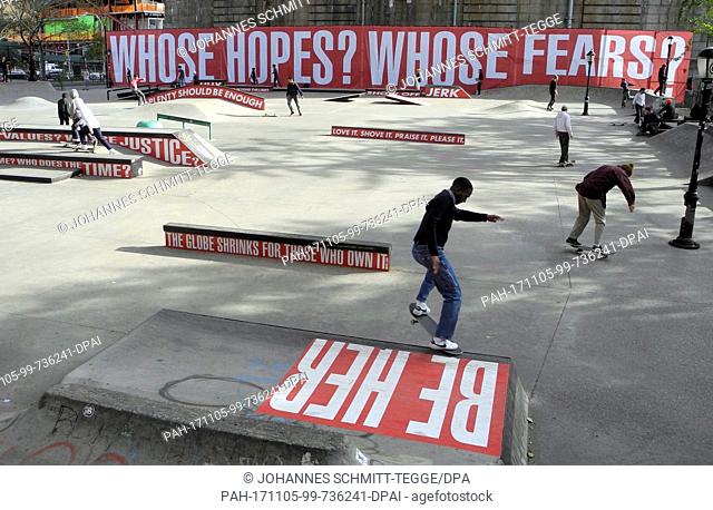 dpatop - Skaters skate in a skatepark over ramps of a parcour adorned with edgy statements by American artist Barbara Kruger in New York, USA, 04 November 2017
