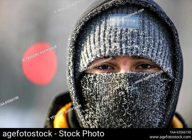 RUSSIA, OMSK - DECEMBER 8, 2023: A man walks in the Siberian city of Omsk on a frosty winter day. According to Russia's weather forecasting agency