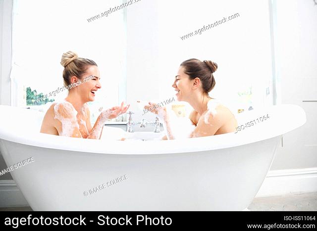 Young women in bubble bath