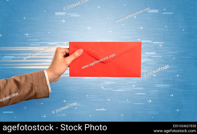Female hand holding empty and full envelope with blue background and direction concept