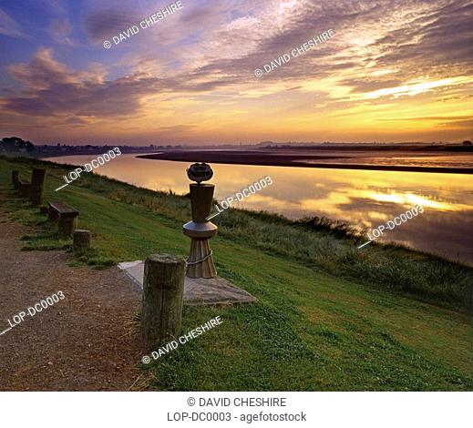 England, Gloucestershire, Newnham-on-Severn, A dawn sky reflects in the water of the River Severn